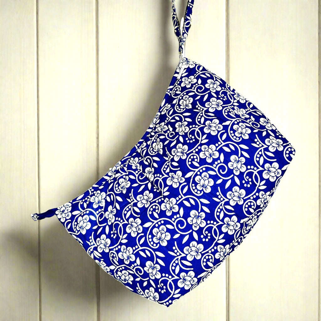 Blue and cream floral wash bag hanging form strap