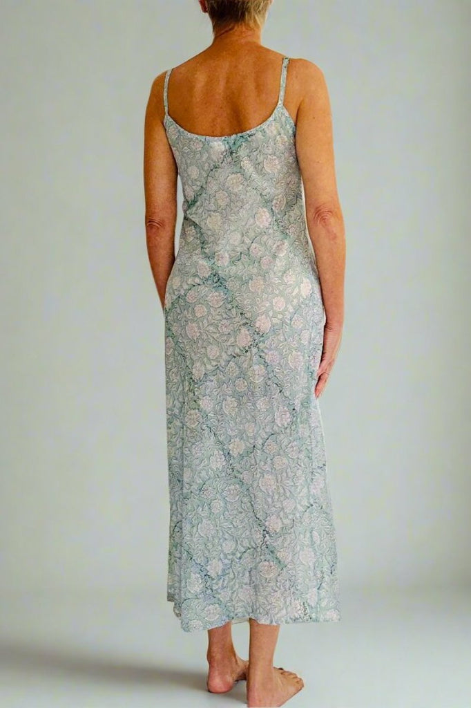 back view of lightweight midi length strappy nightie in pale green and white paisley print