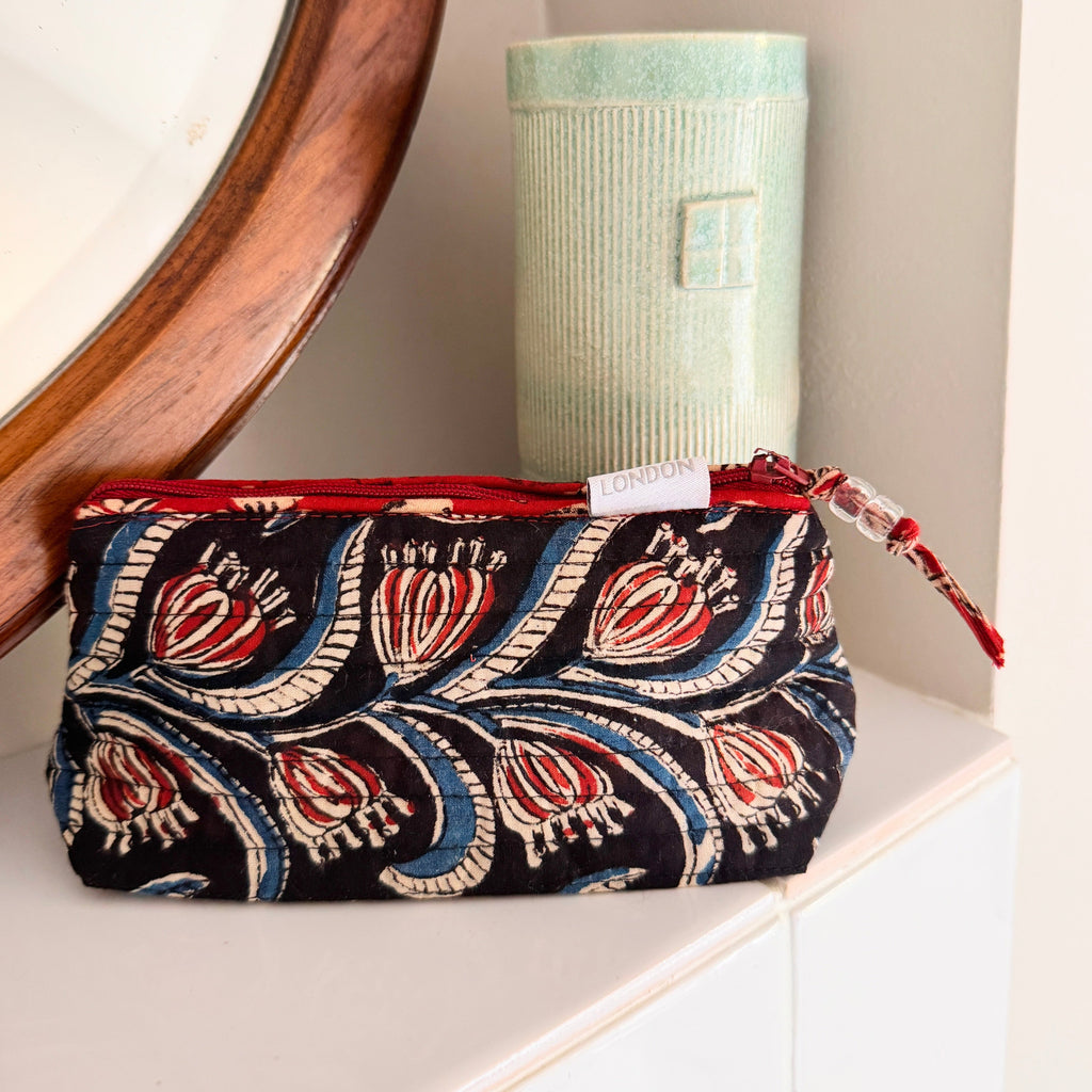 small size mini make up bag made from quilted cotton hand block print in black, cream, blue and red