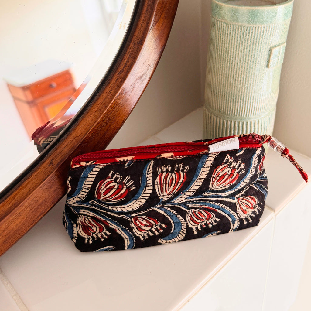 small size mini make up bag made from quilted cotton hand block print in black, cream, blue and red to carry small make up essentials