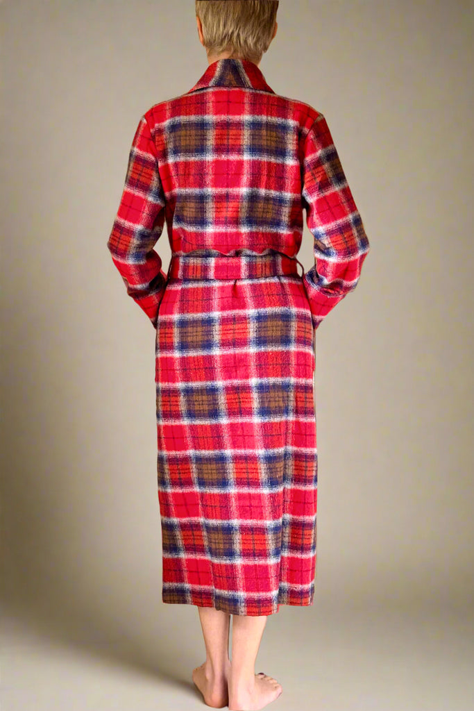 back view of woman in a red, blue and brown check belted winter dressing gown