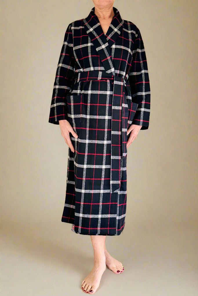 woman wearing black, white and red windowpane checked dressing gown with shawl collar